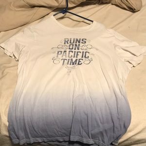 White and blue tee that says runs on pacific time